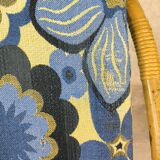 Vintage armchair in rattan and floral fabric