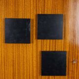 Pair of mahogany veneer and black lacquered iron cabinets. 1950s.