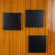 Pair of mahogany veneer and black lacquered iron cabinets. 1950s.