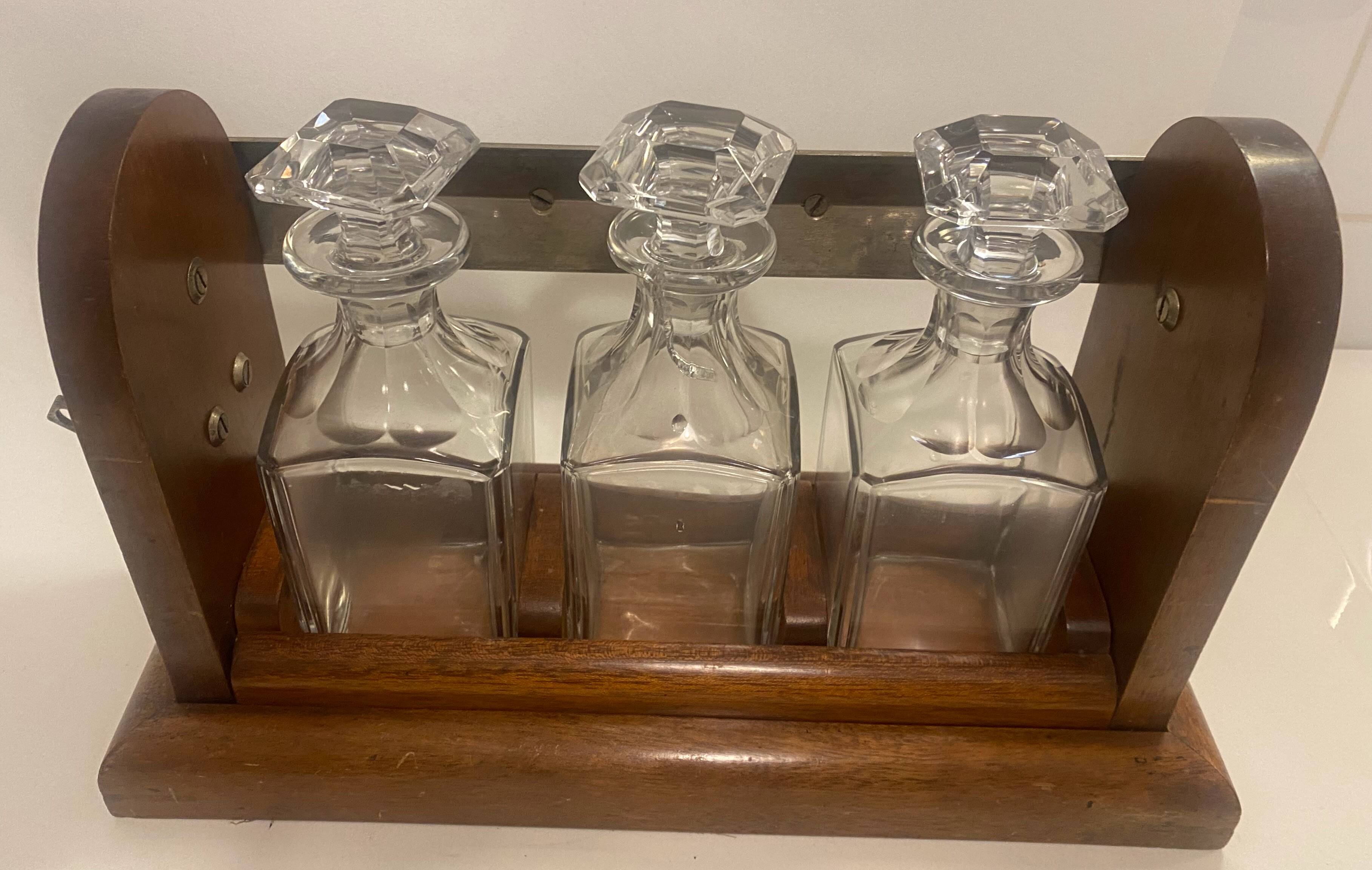 Portable Art Deco liquor cabinet in mahogany & metal with 3 Baccarat crystal bottles.