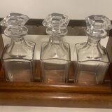 Portable Art Deco liquor cabinet in mahogany & metal with 3 Baccarat crystal bottles.