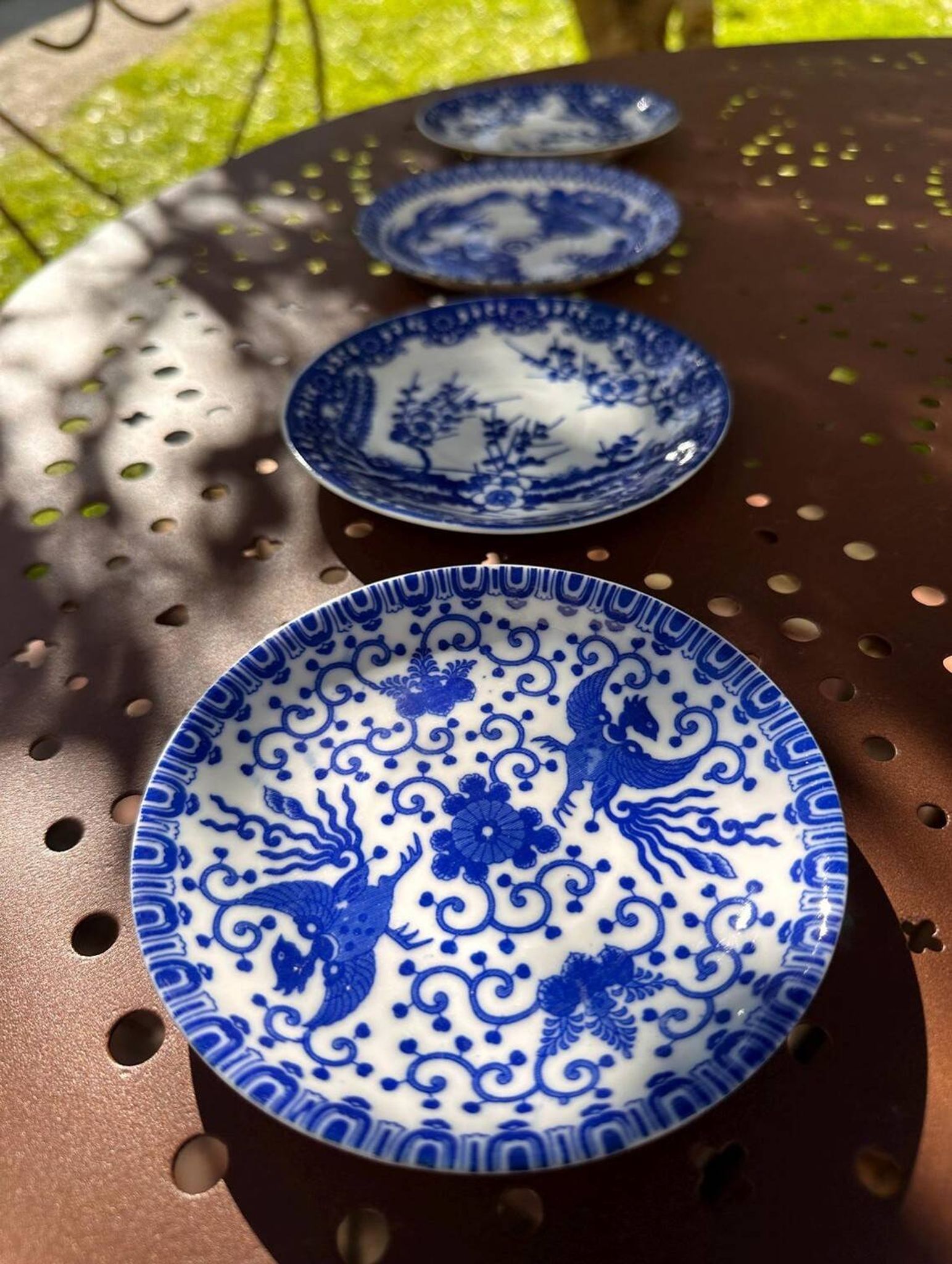 Small vintage plates made in Japan in blue and white porcelain.
