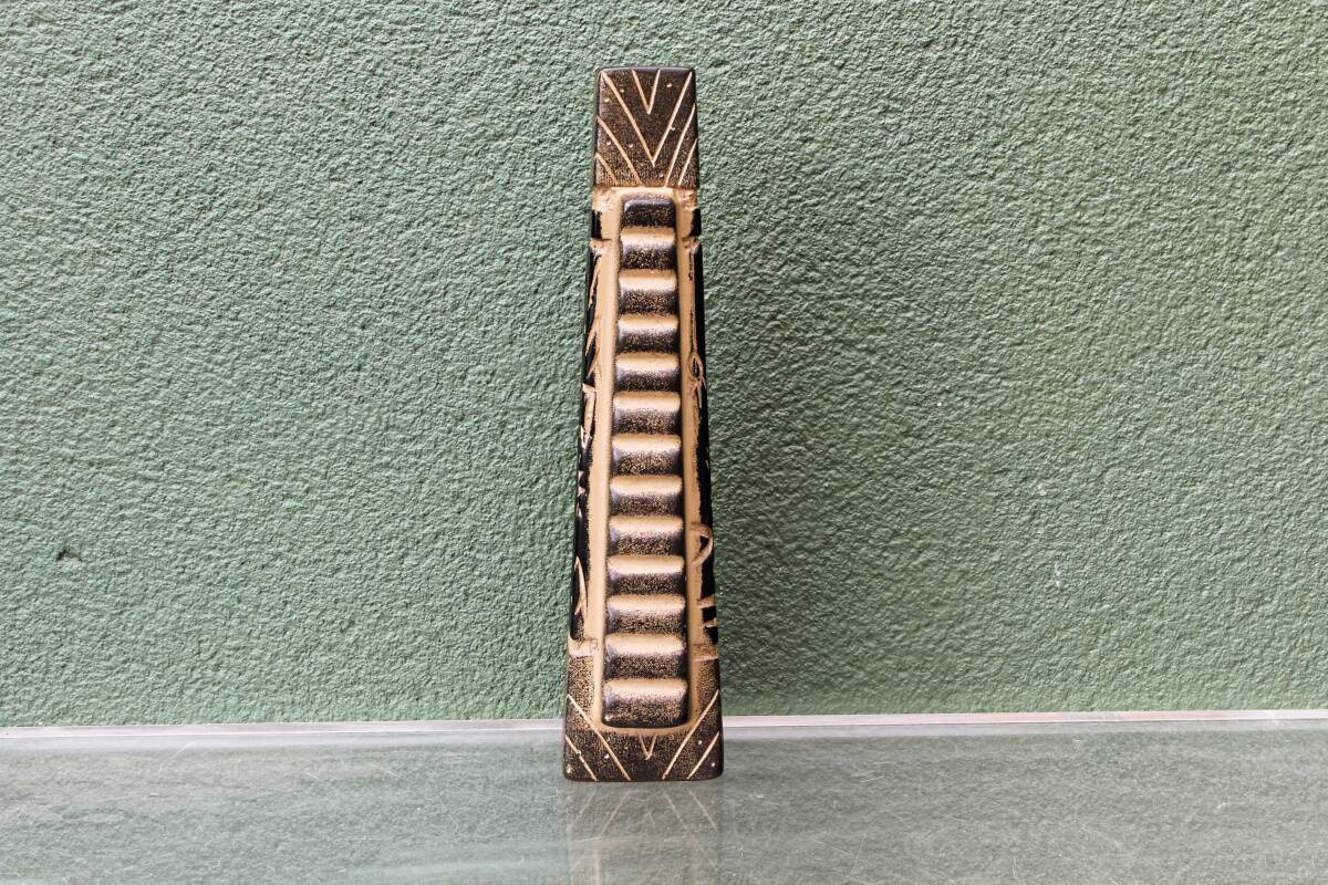 Modernist ceramic vase, signed, with incised geometric tribal decoration.