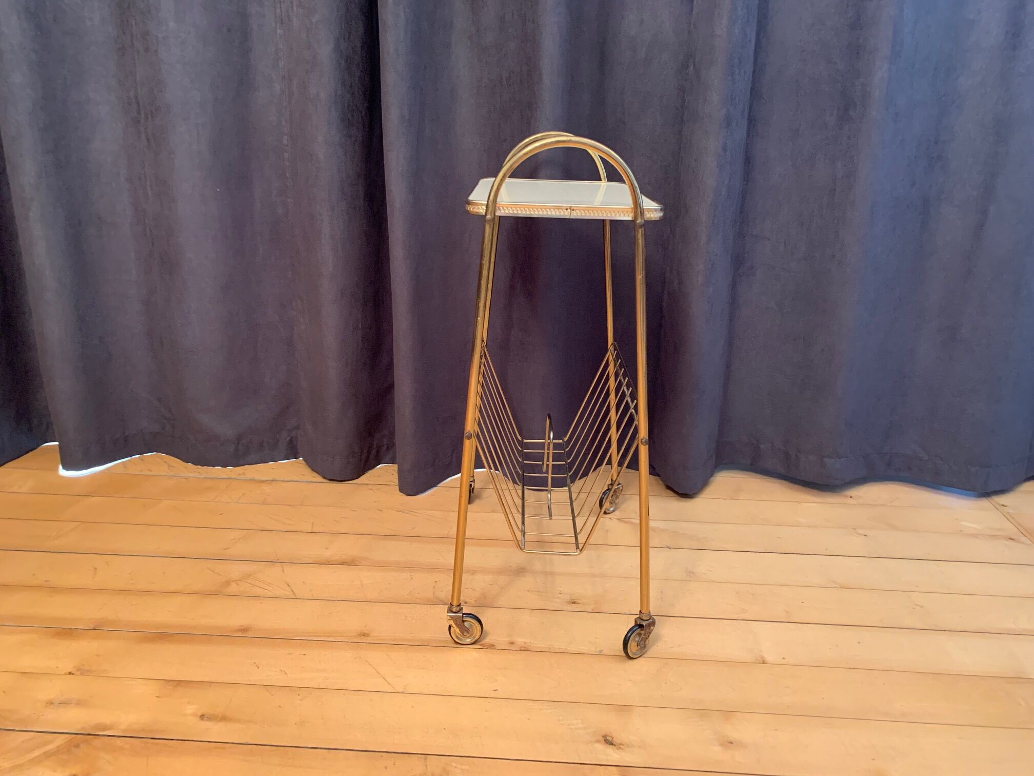 Mobile newspaper holder, 1960s