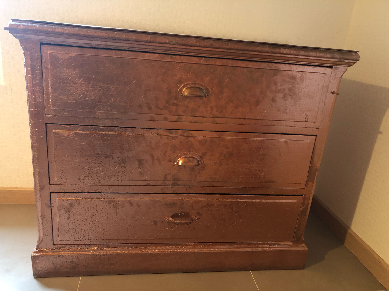 Old chest of drawers restored golden copper color