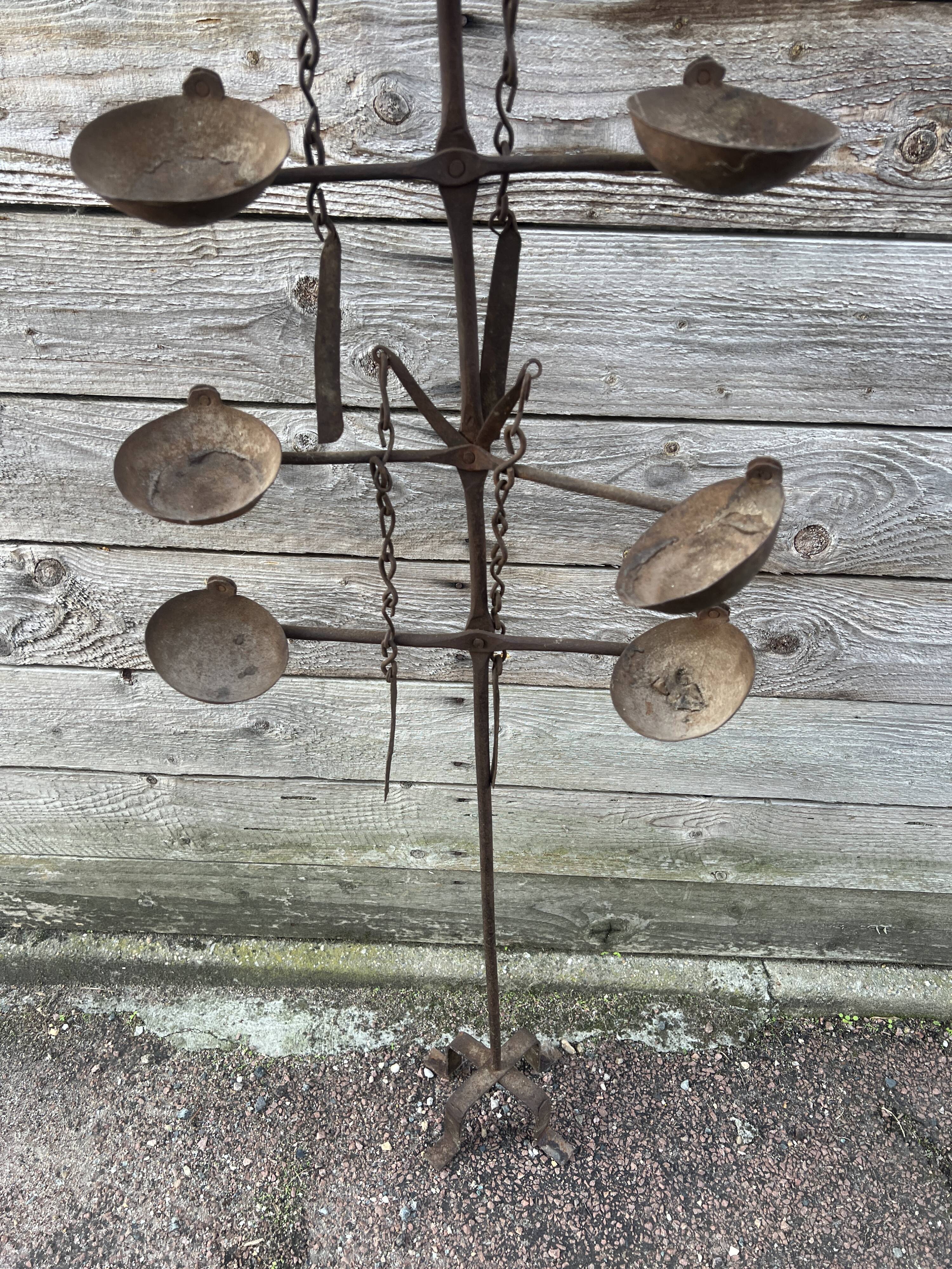 African oil lamps on stands