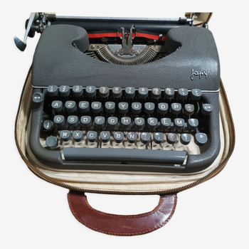 Old Japy typewriter and its carrying case with notice