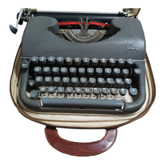 Ancienne machine à écrire Japy et sa mallette de transport avec notice