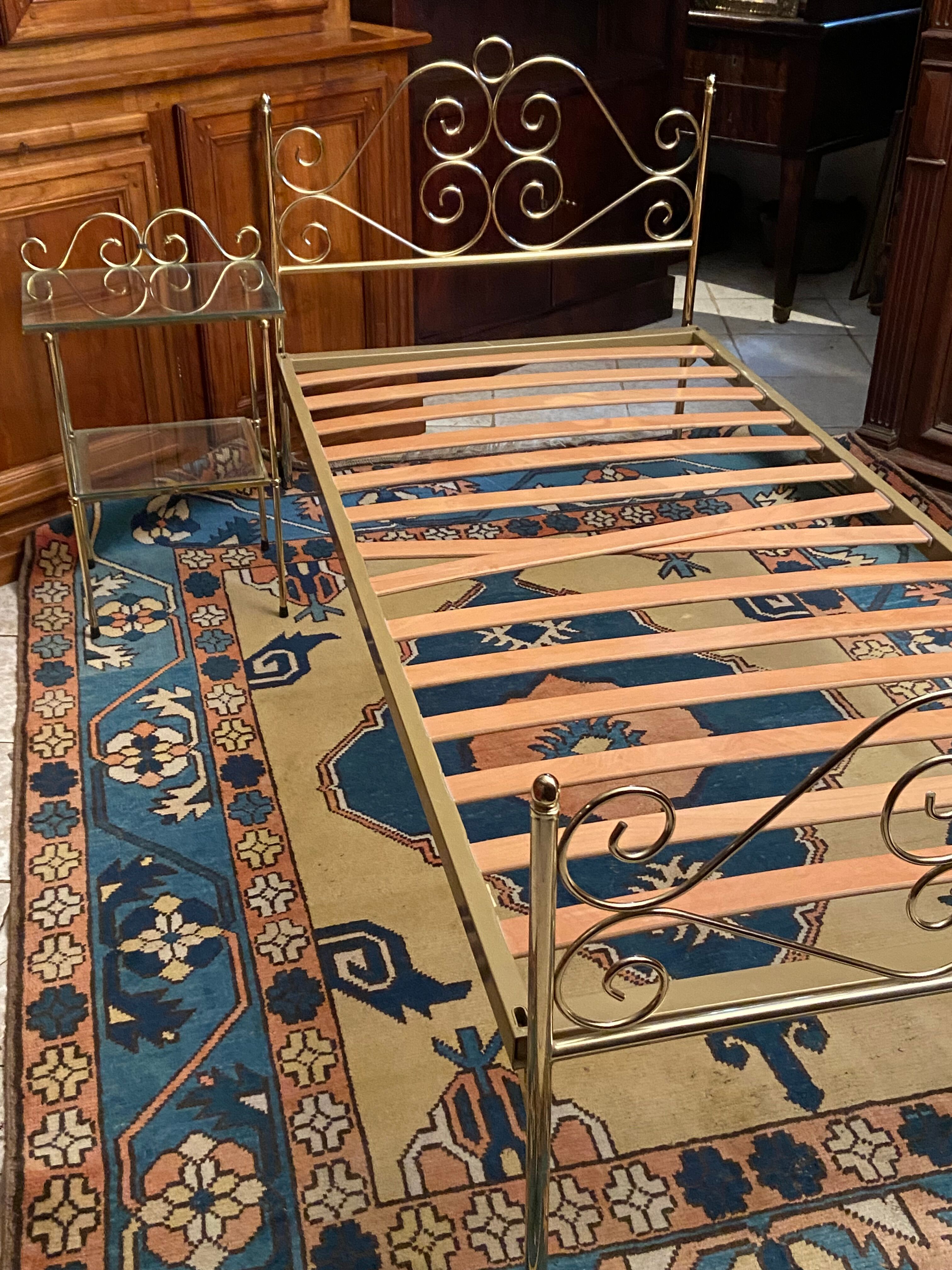 Romantic style single bed in brass with bedside table