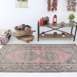 Tapis turc en laine rose poussiéreux