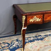 Louis XV style desk. Rosewood veneer, gilt bronze decoration, leather.