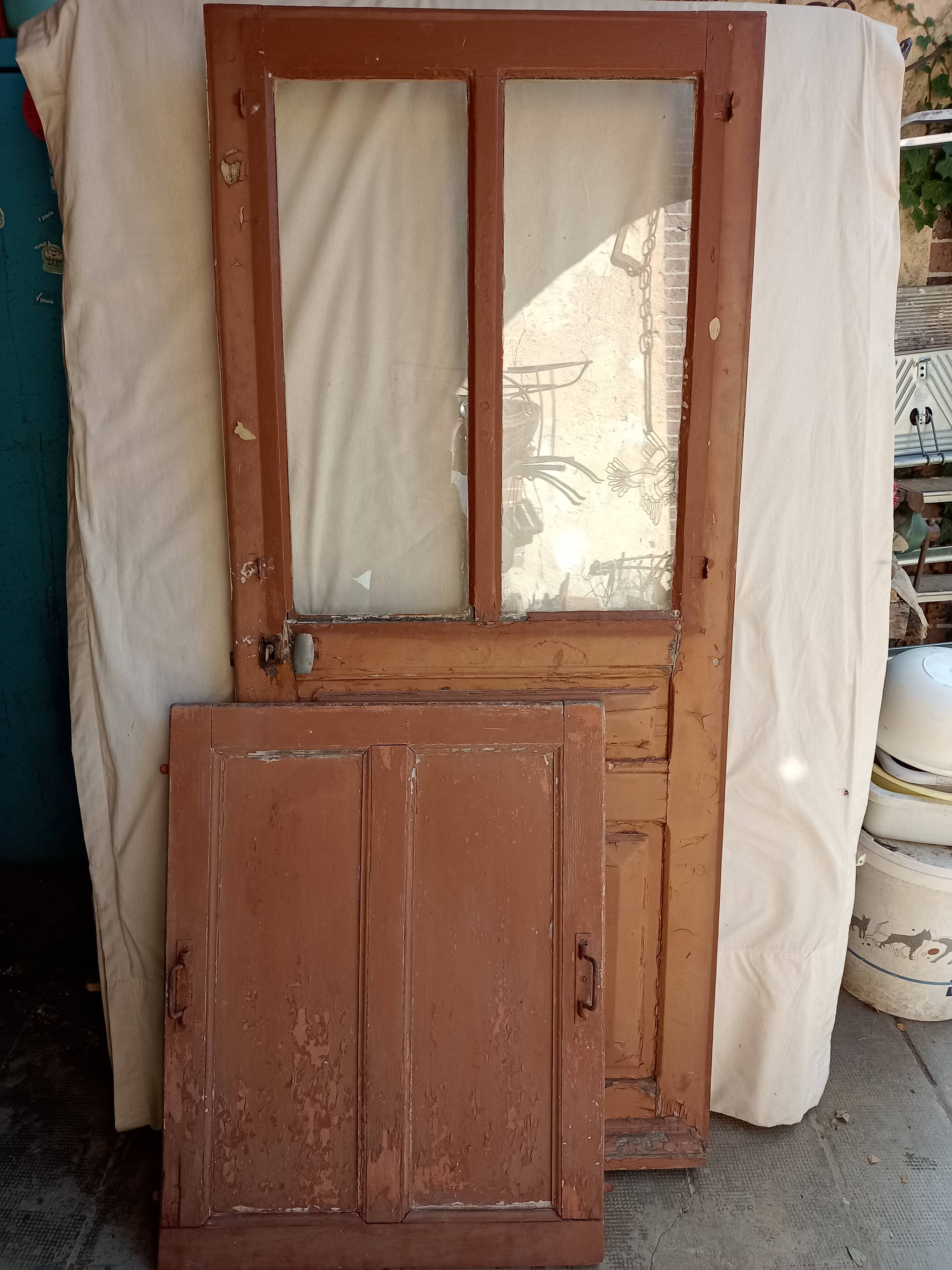 Old glazed door with its shutter