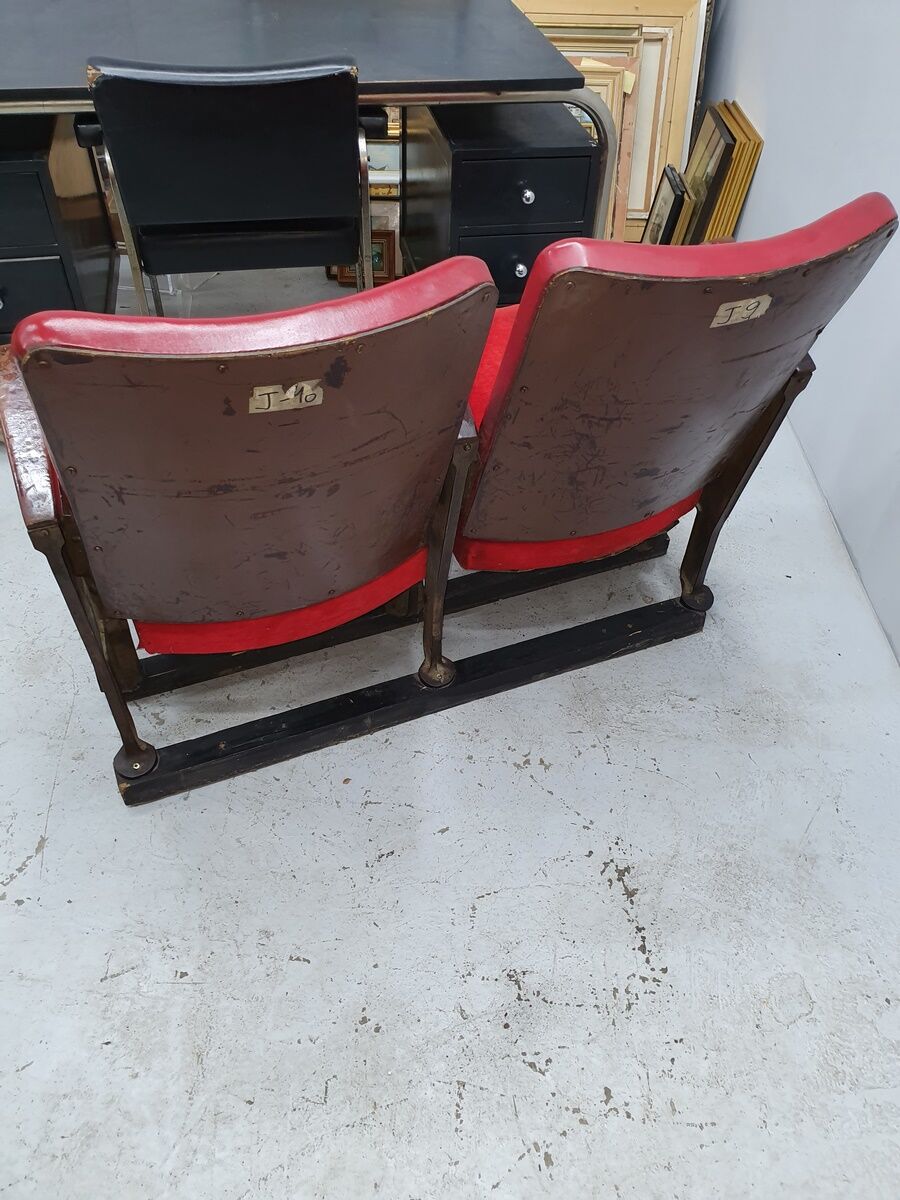 Series of 5 red skai and patinated cast Theater chairs