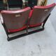 Series of 5 red skai and patinated cast Theater chairs