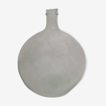 Old transparent demijohn from about 12 to 15L