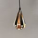 A teardrop-shaped pendant lamp made of copper, black metal, and prisms.