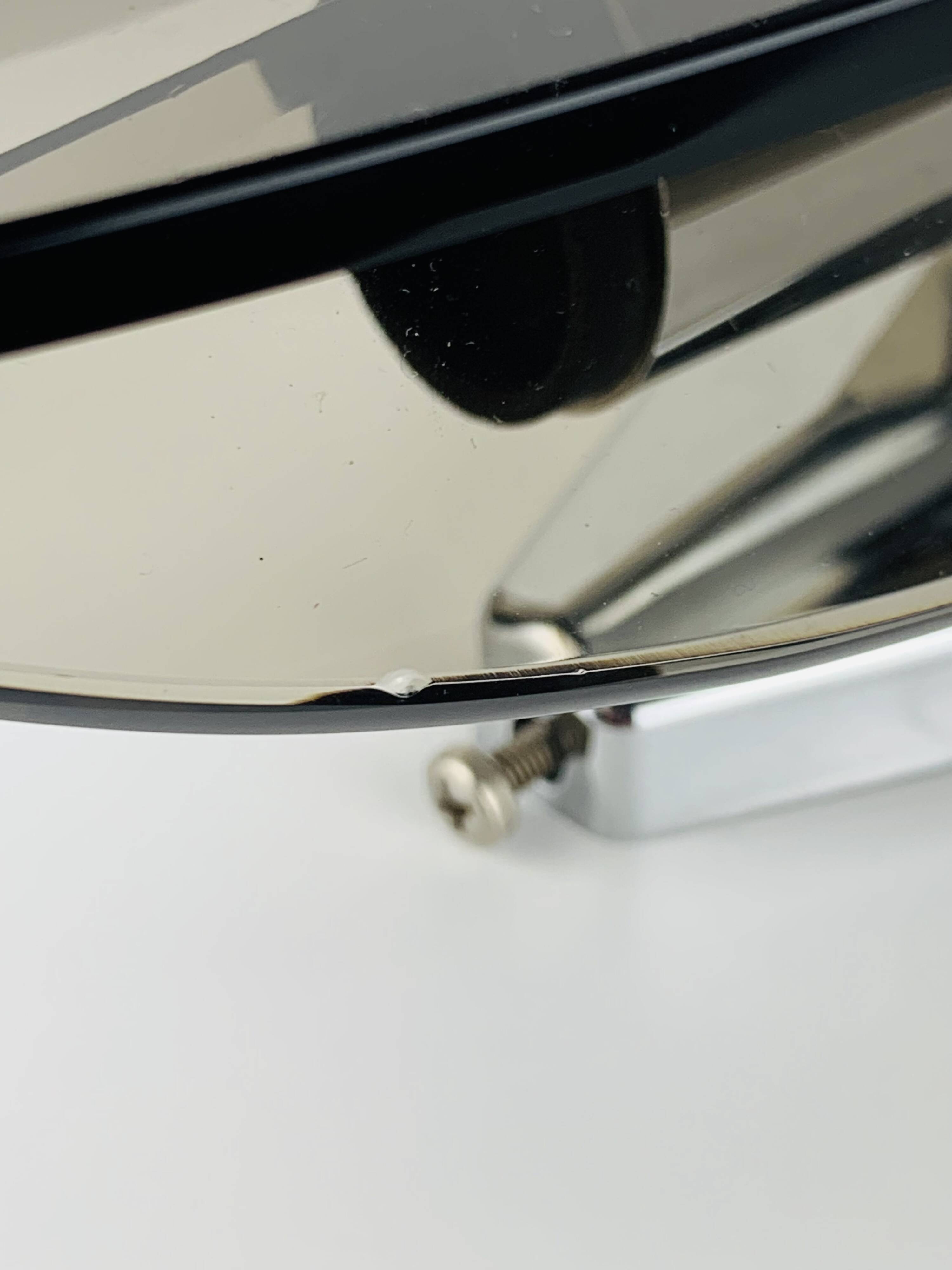 Pair of smoked glass and chrome wall lights from the 1970s.