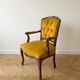 Louis XV style armchair in yellow velvet.