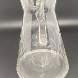 Glass and carafe set with chiseled flower motif