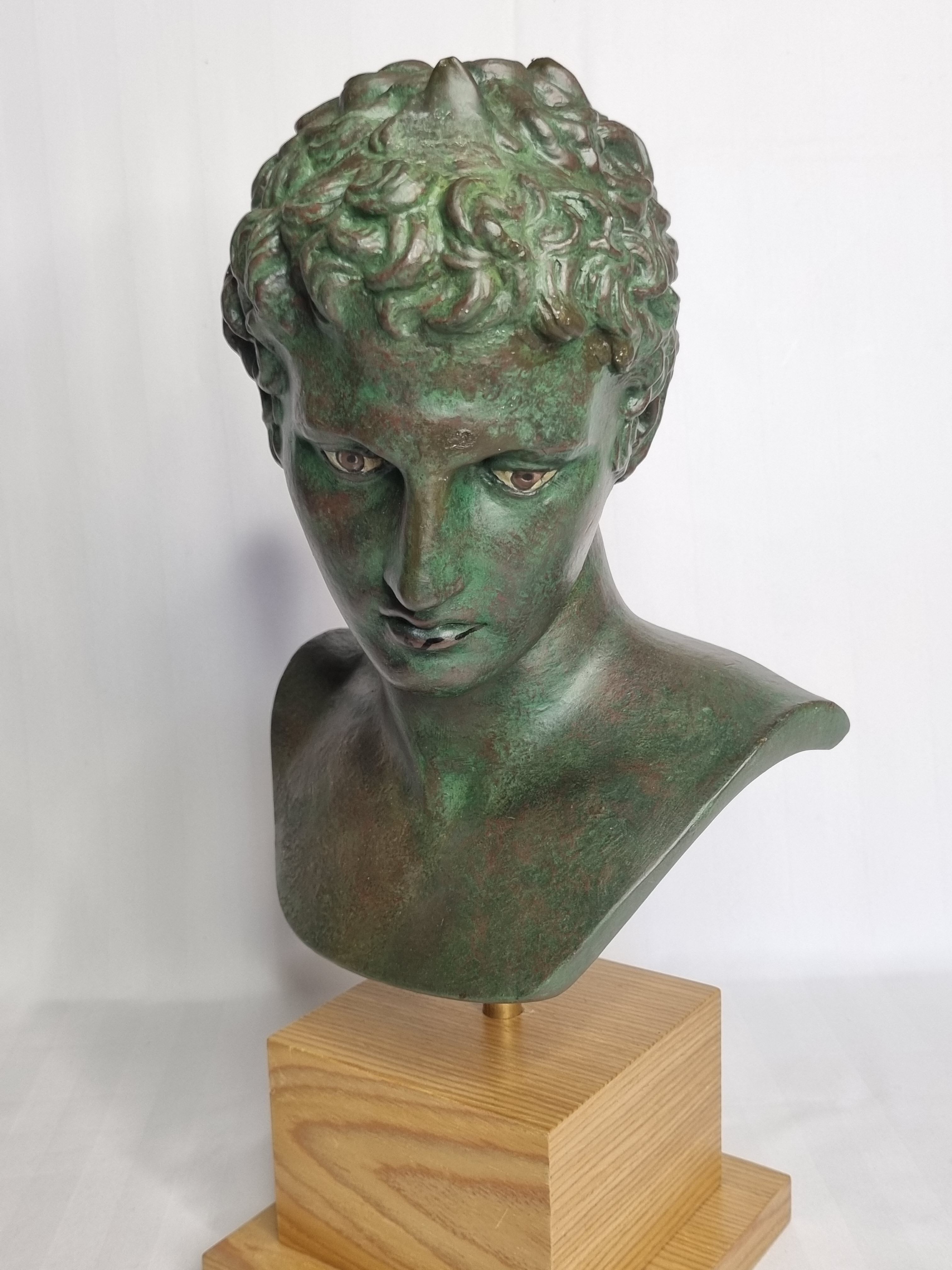 Bust of the Ephebus of Marathon in patinated plaster on base
