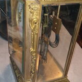 Cage pendulum with its double mercury bulb pendulum.