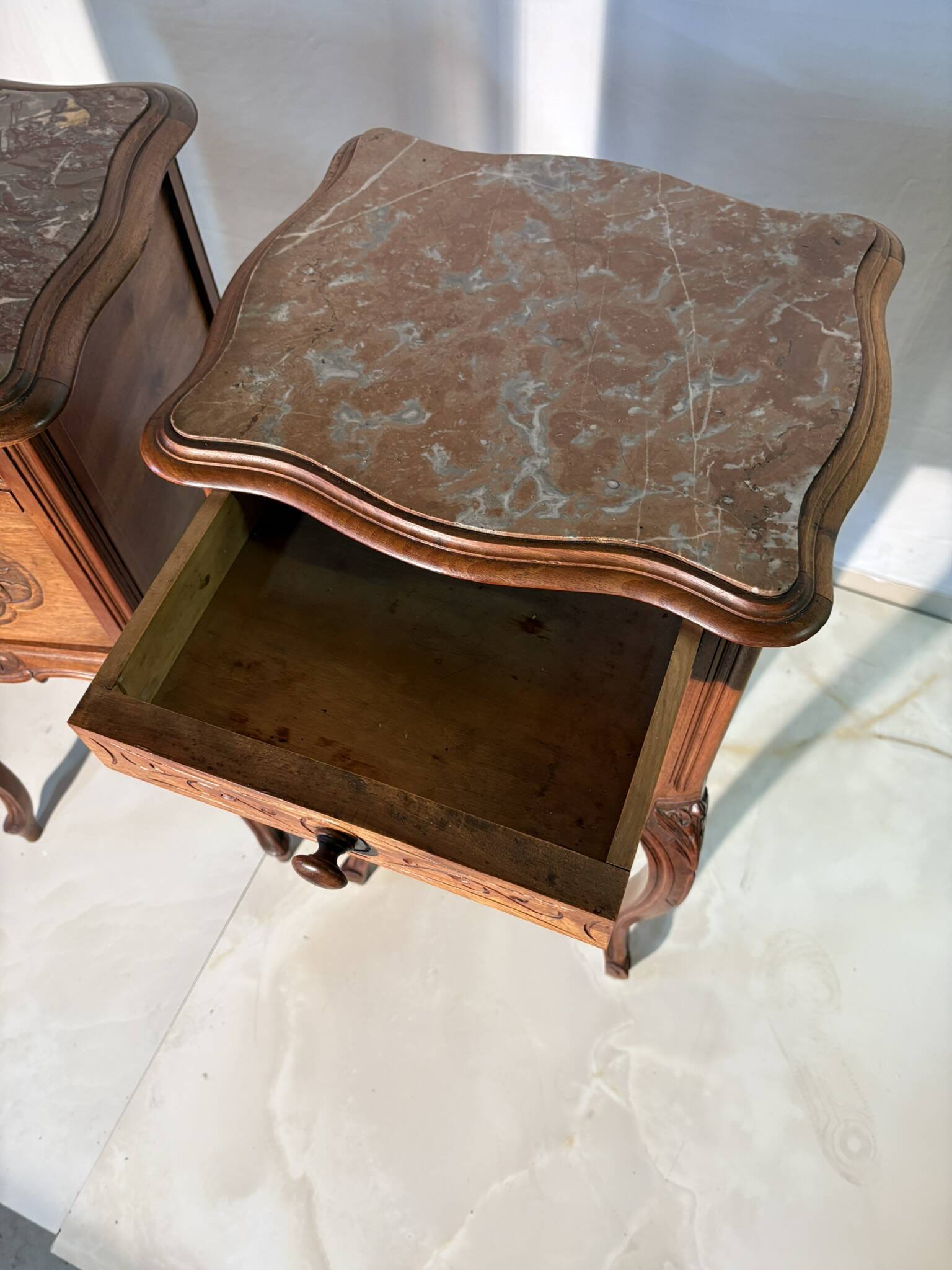 Pair of antique bedside tables with marble top and ceramic niche