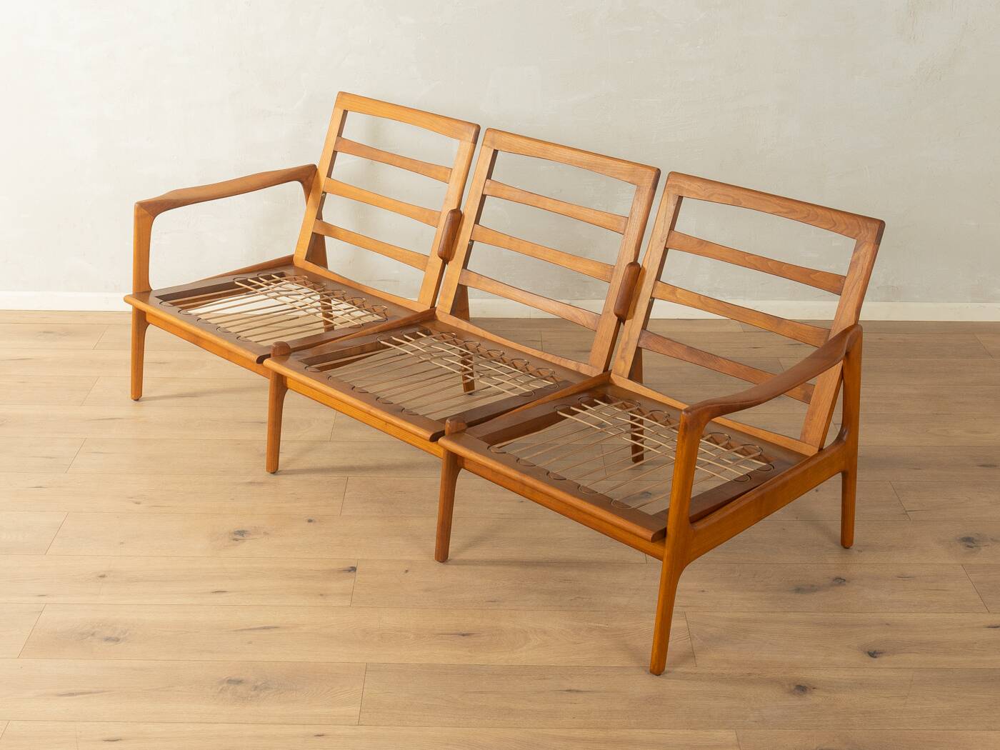 Elegant mid-century sofa from the 1960s with cream-white upholstery