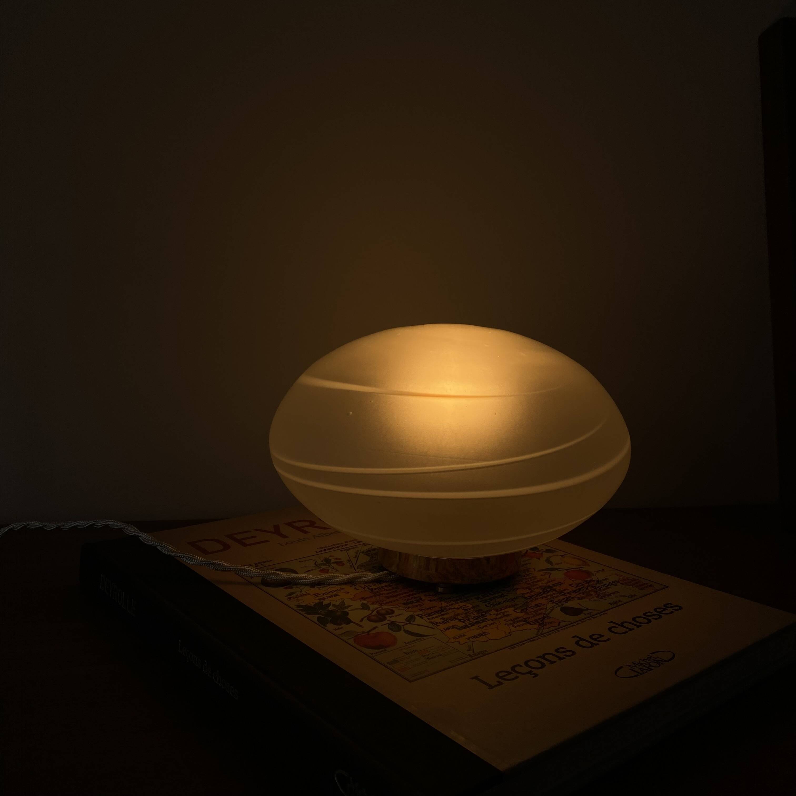 Vintage desk table lamp in antique glass with a brass base.