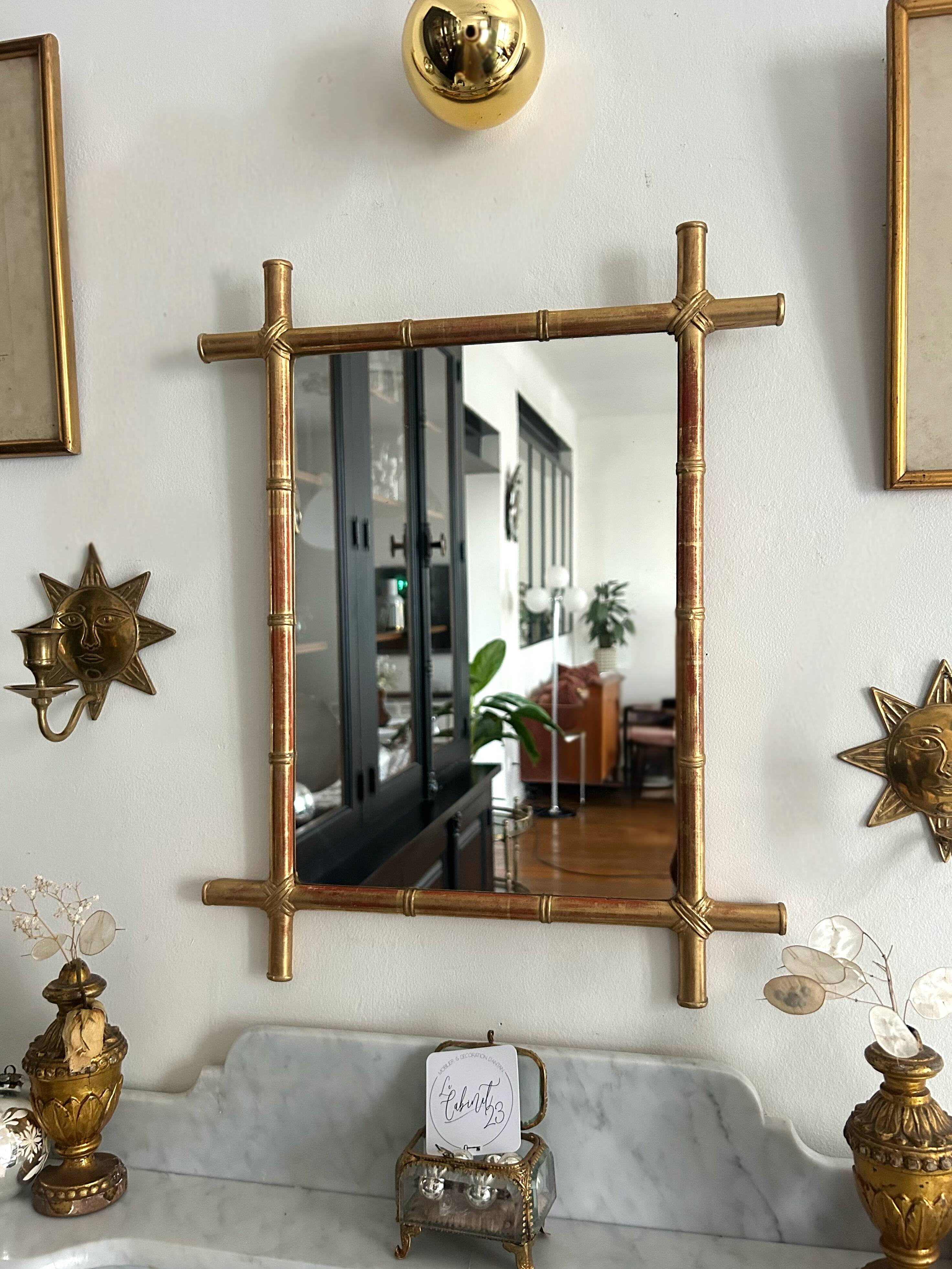 Mirror in gilded stucco, bamboo patina and gold leaf.