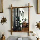 Mirror in gilded stucco, bamboo patina and gold leaf.