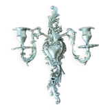 Cast iron wall candle holder with patinated gold metal