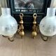 Pair of vintage wall sconces in brass and frosted engraved glass.