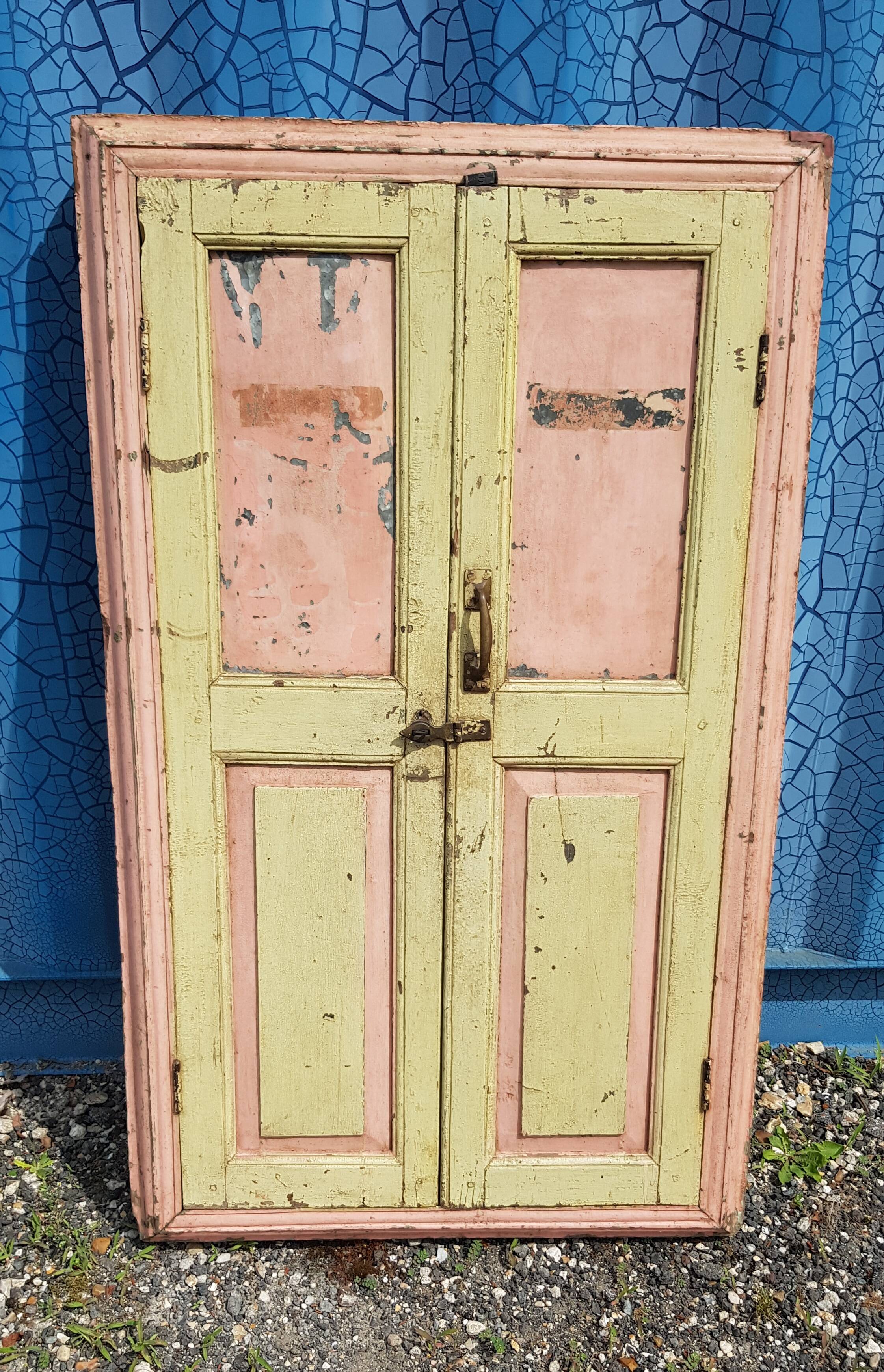 Old polychrome Burmese teak window with interior mirror.