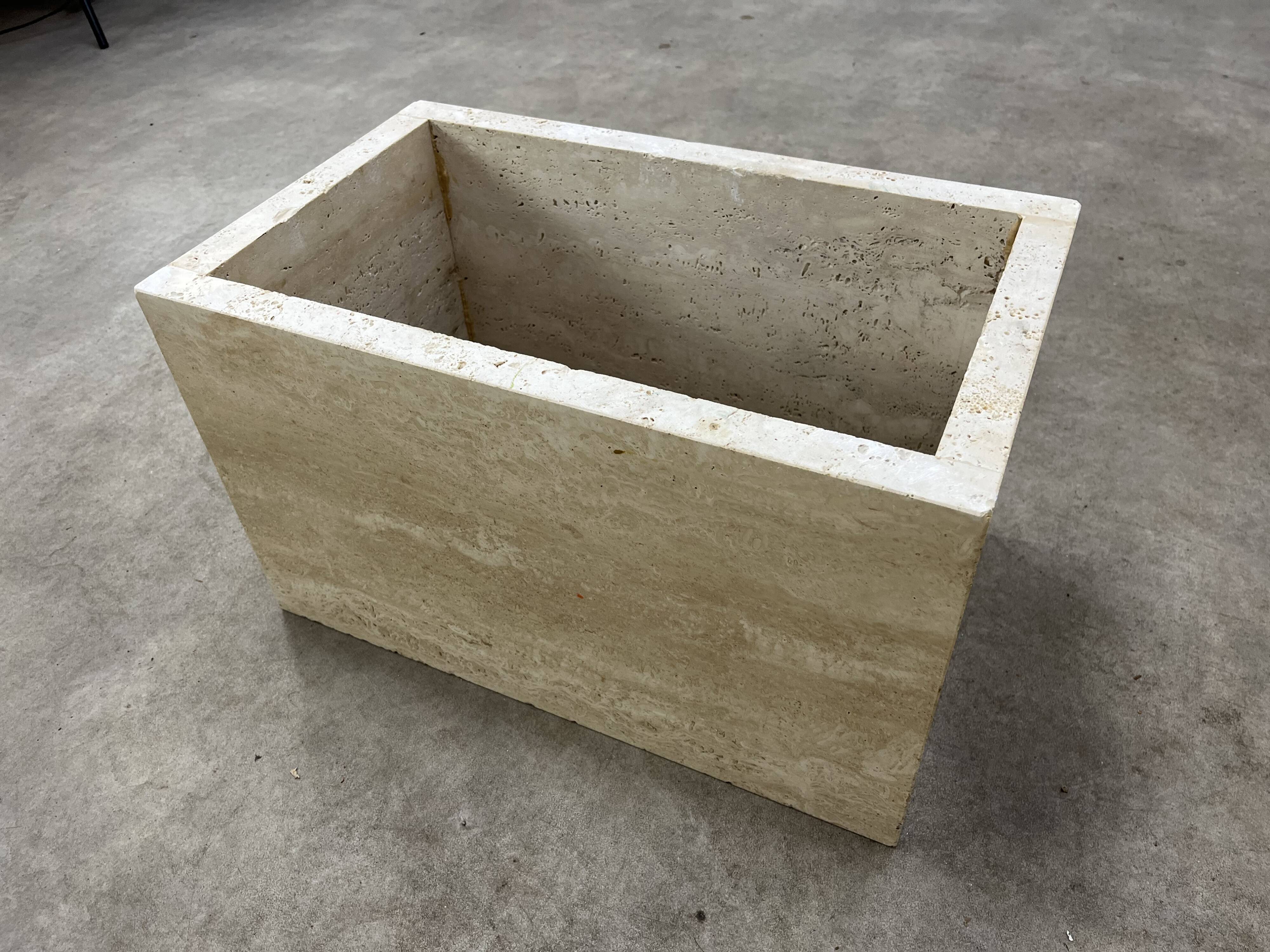 Rectangular travertine coffee table with central leg