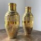 Duo of embossed brass vases