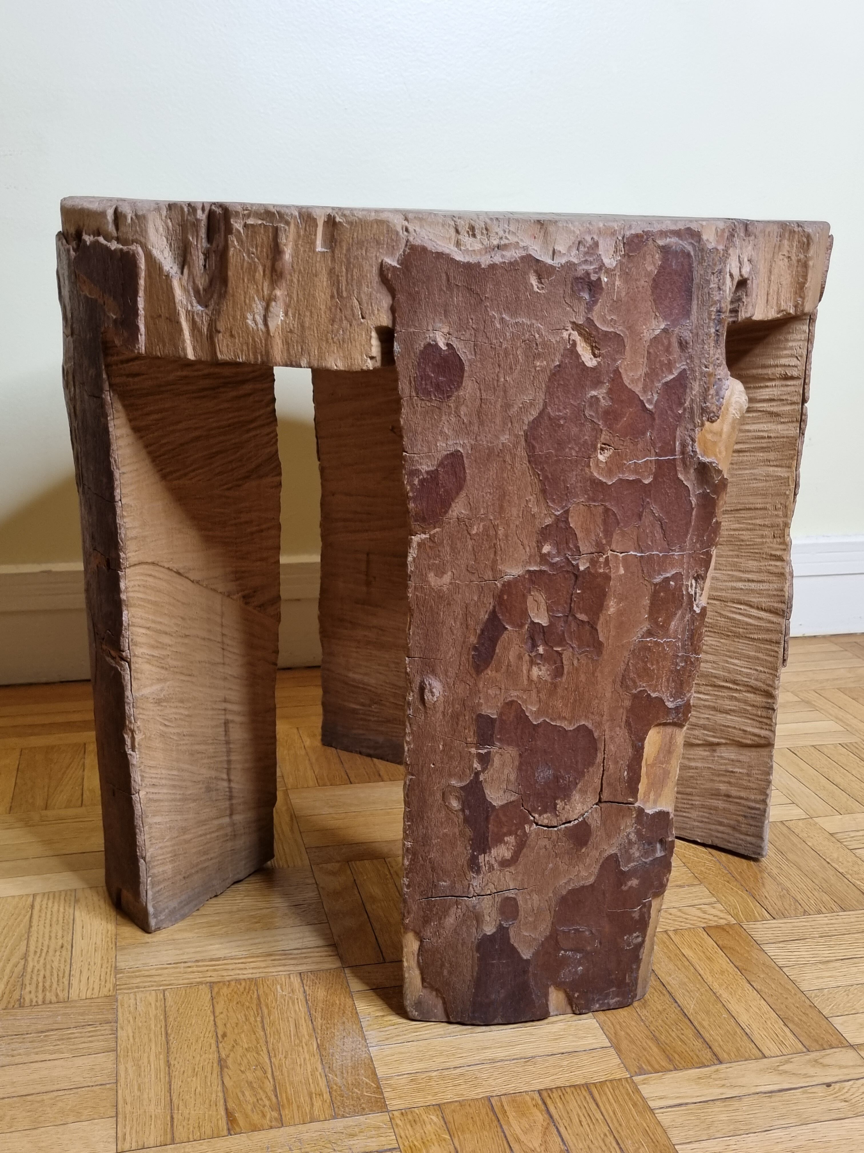 Brutalist solid wood coffee table carved from a room in a plane tree trunk