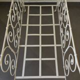 White wrought iron folding bed