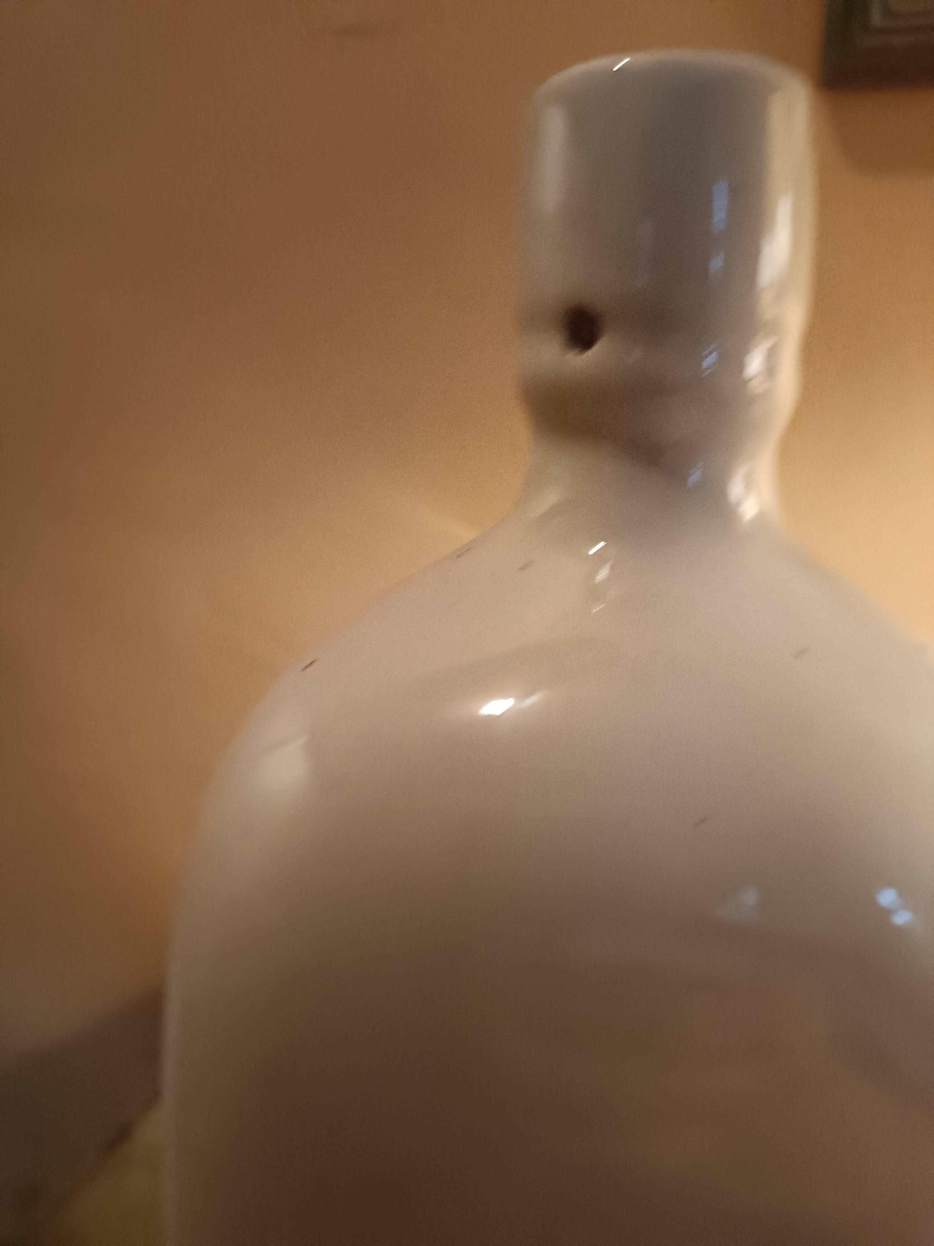 Triangular stoneware bottle