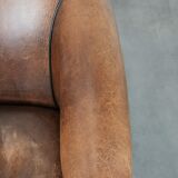 Sturdy vintage sheepskin club armchair with a beautiful patina