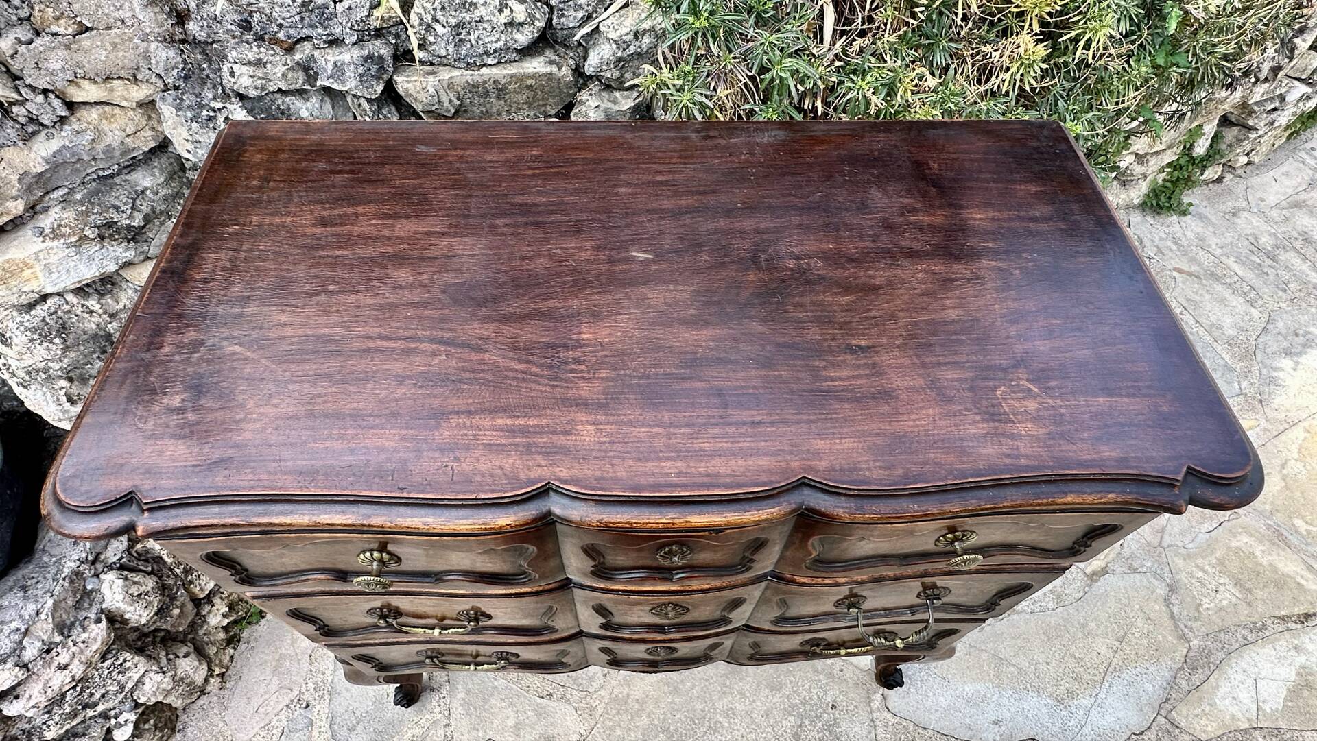 Carved and moulded solid wood commode in the Louis XV style.
