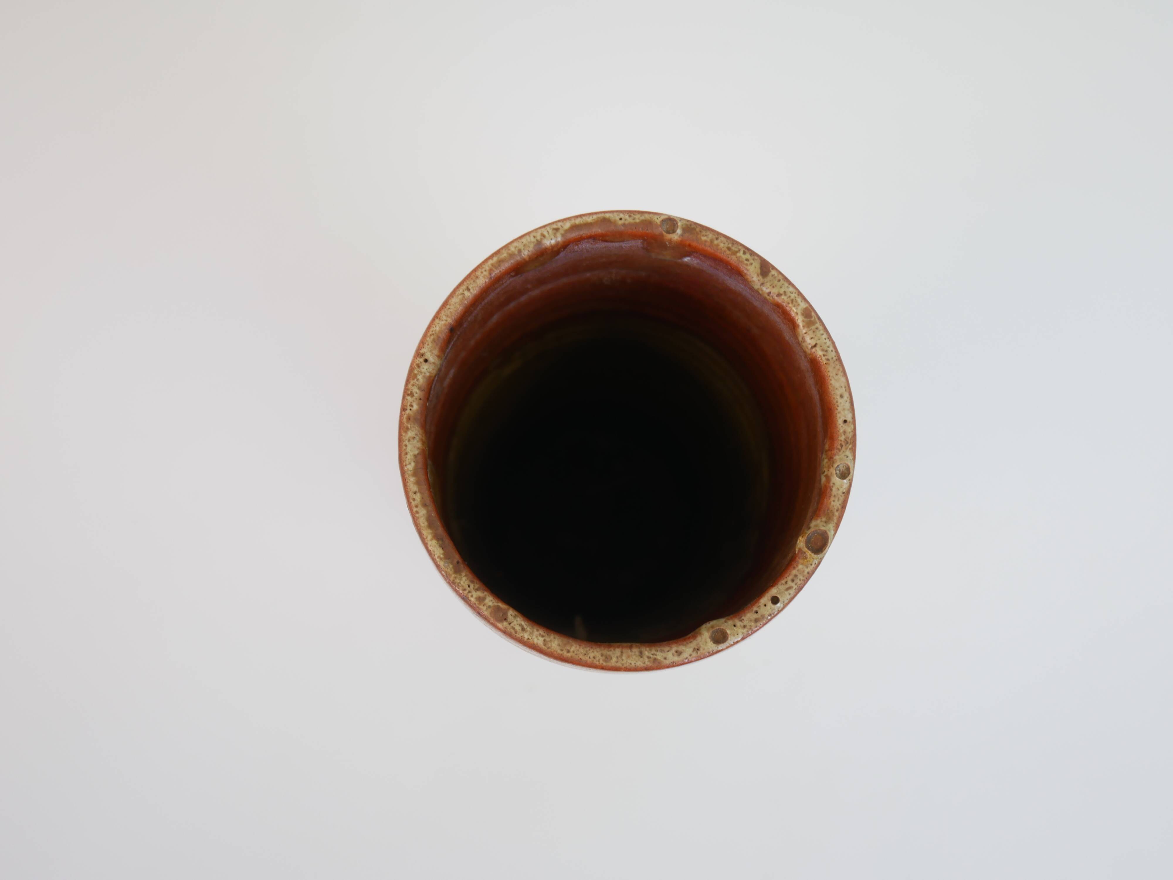 Brown ceramic tube vase signed Roger Jacques under the base