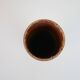Brown ceramic tube vase signed Roger Jacques under the base