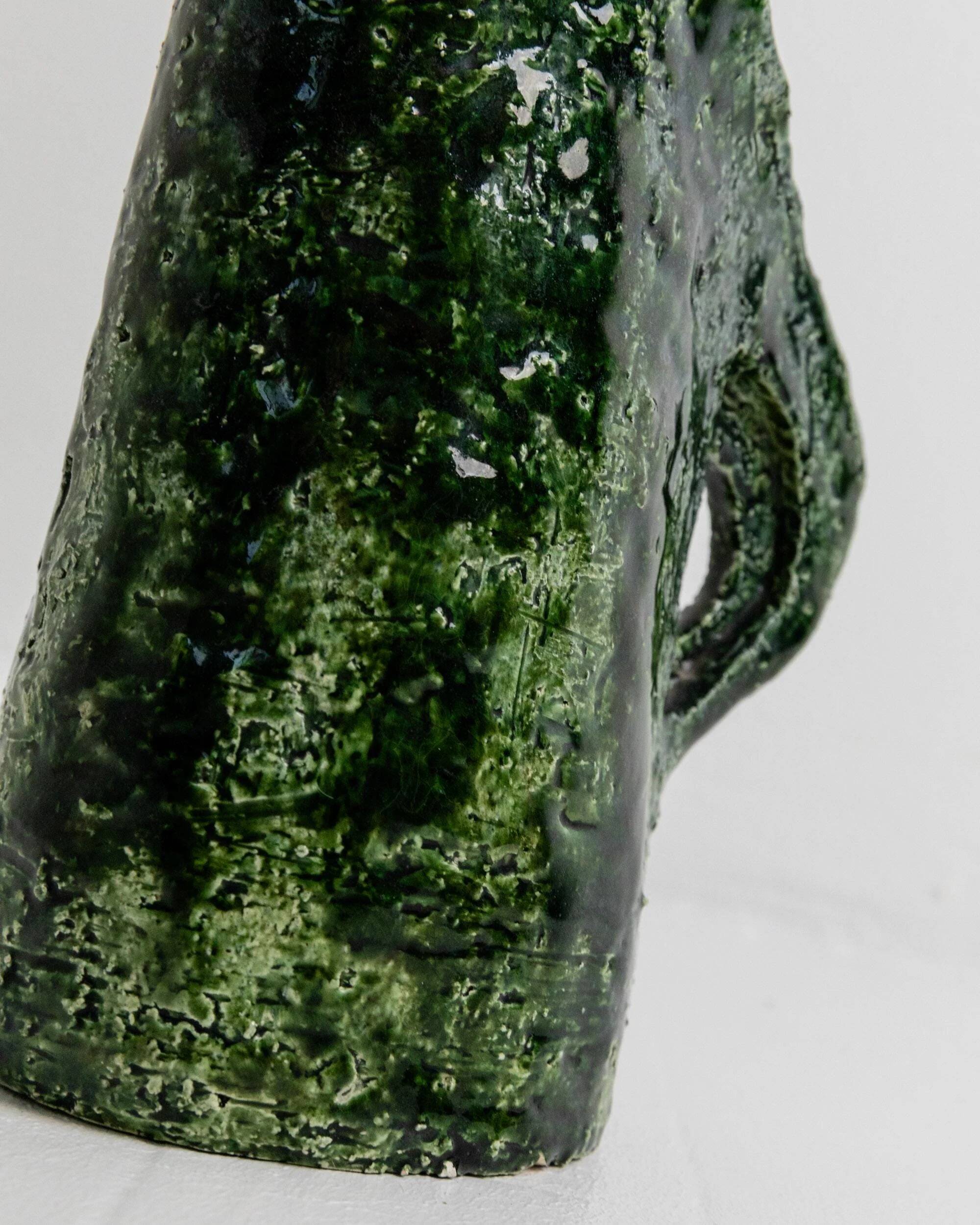 Vintage 1970s studio ceramic vase or pitcher, glazed green.