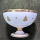 Empire-style footed cup in white porcelain, richly decorated with fine gold.