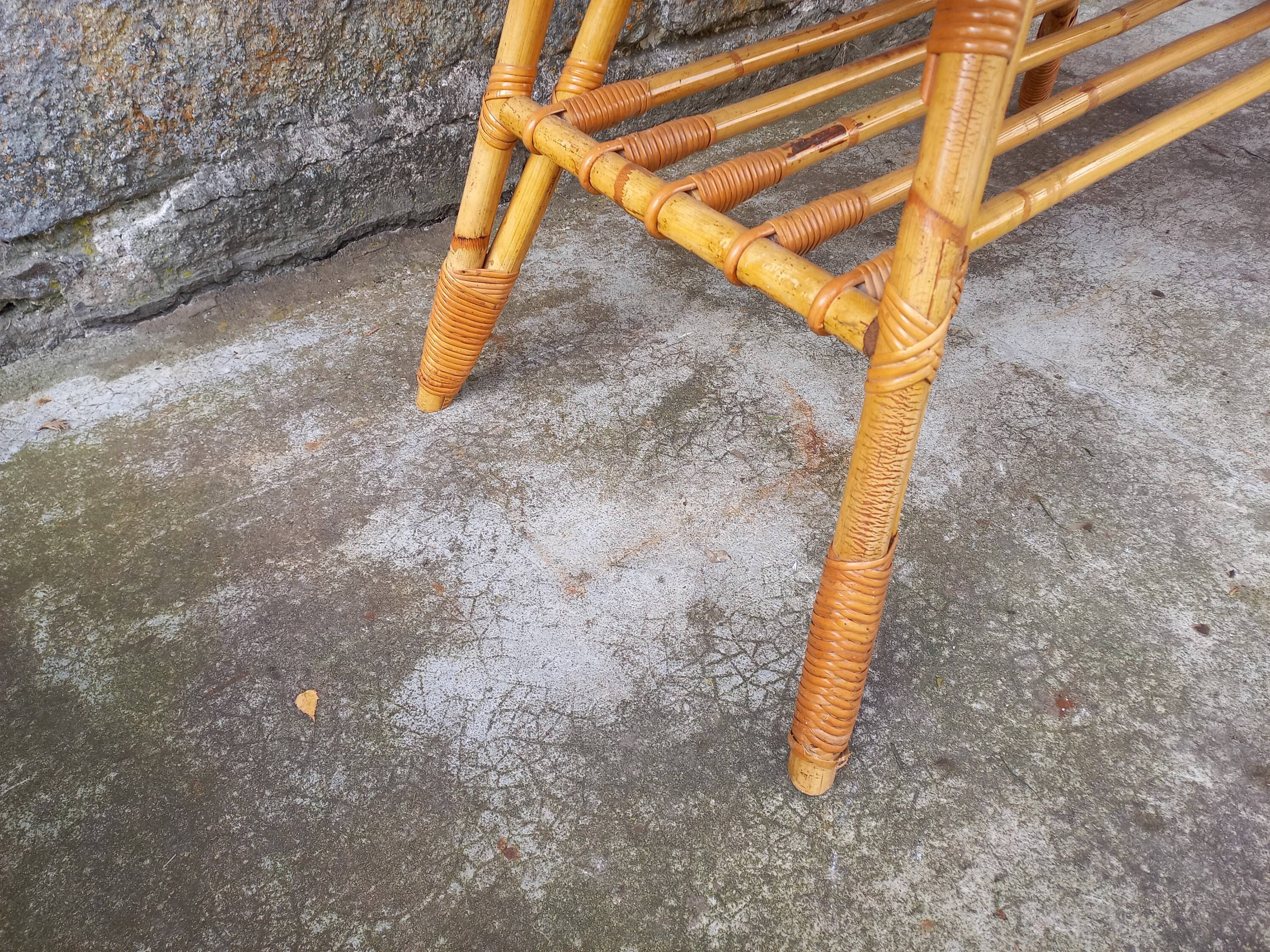 Rattan coffee table with compass legs