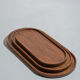 Trio of oval teak trays or cups