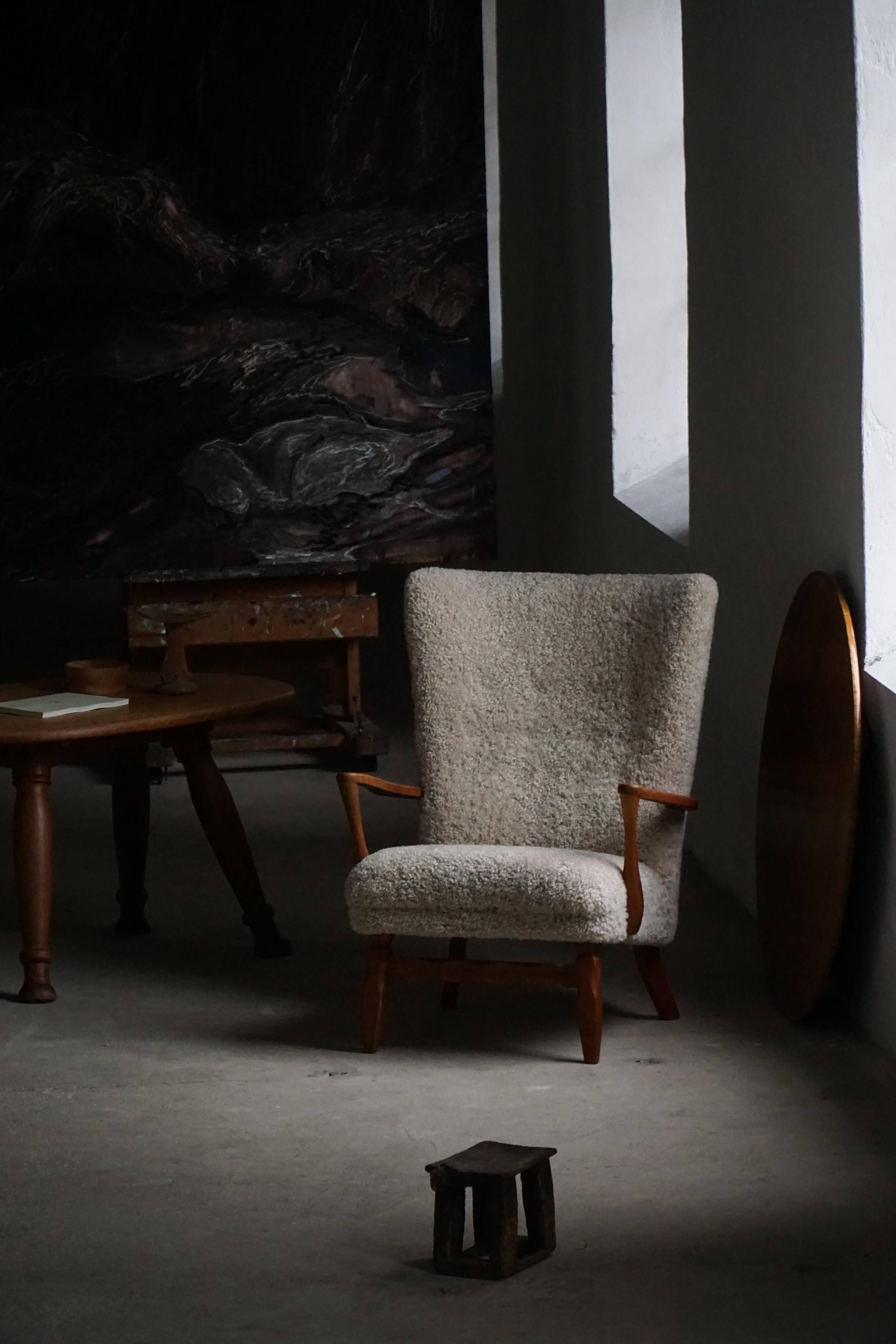 Viggo Boesen, high-back chair in oak and shearling lambskin, modern Danish design, 1950s.