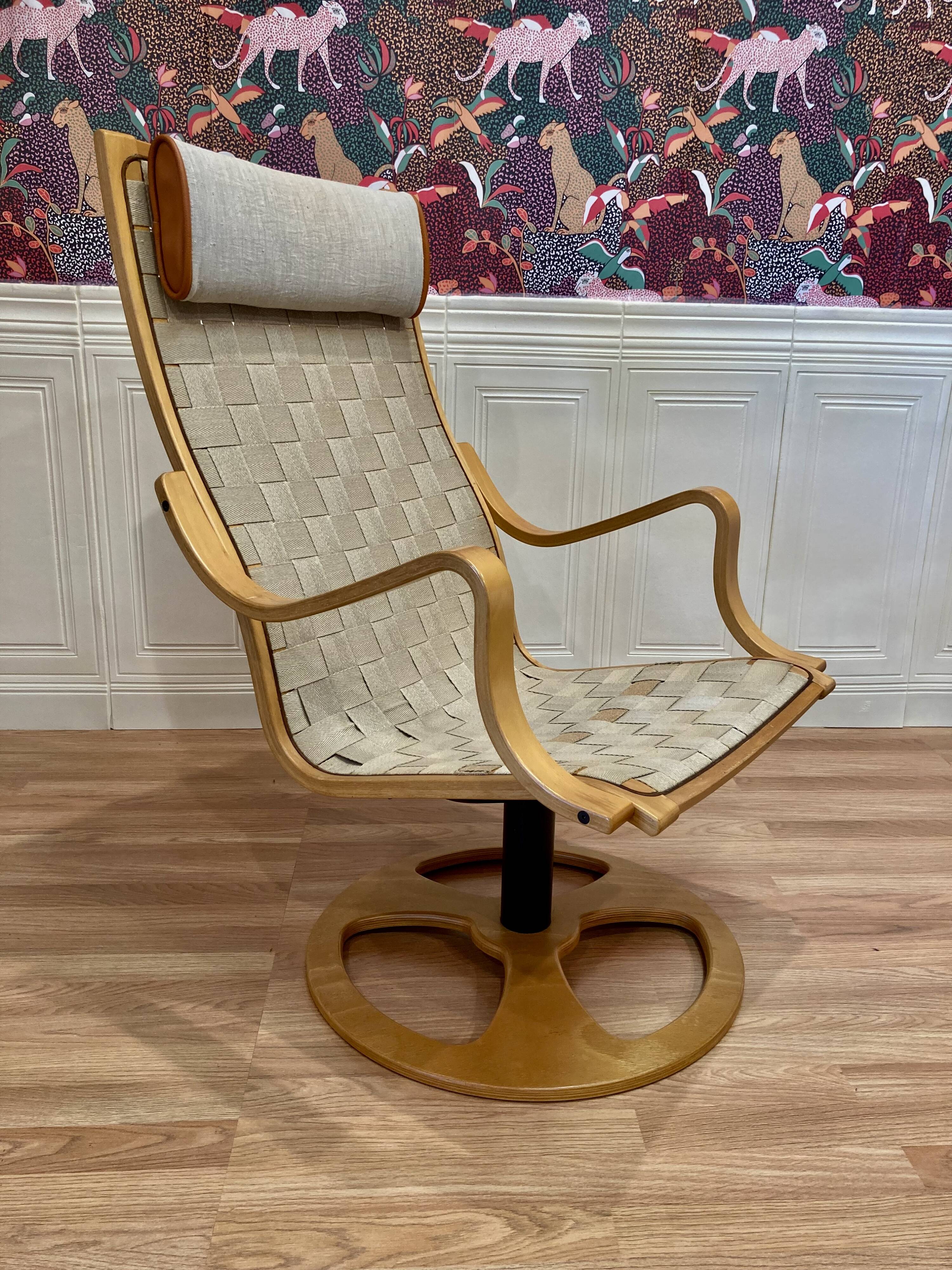 Swivel armchair and its ottoman in 1960s Scandinavian design.