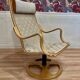 Swivel armchair and its ottoman in 1960s Scandinavian design.