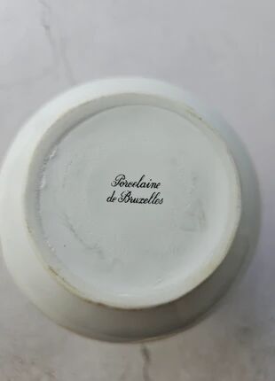 Brussels porcelain vase with a gold rim and flowers